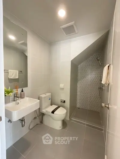 Modern bathroom with sleek design and spacious shower area