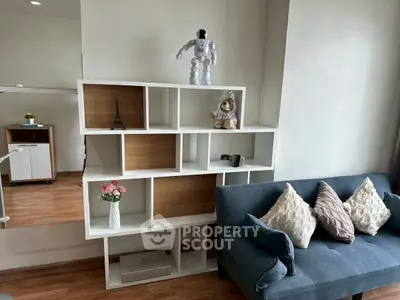 Modern living room with stylish shelving and cozy sofa