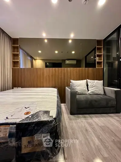 Modern bedroom with stylish decor and cozy seating area