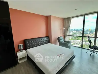 Spacious bedroom with stunning city view and modern furnishings