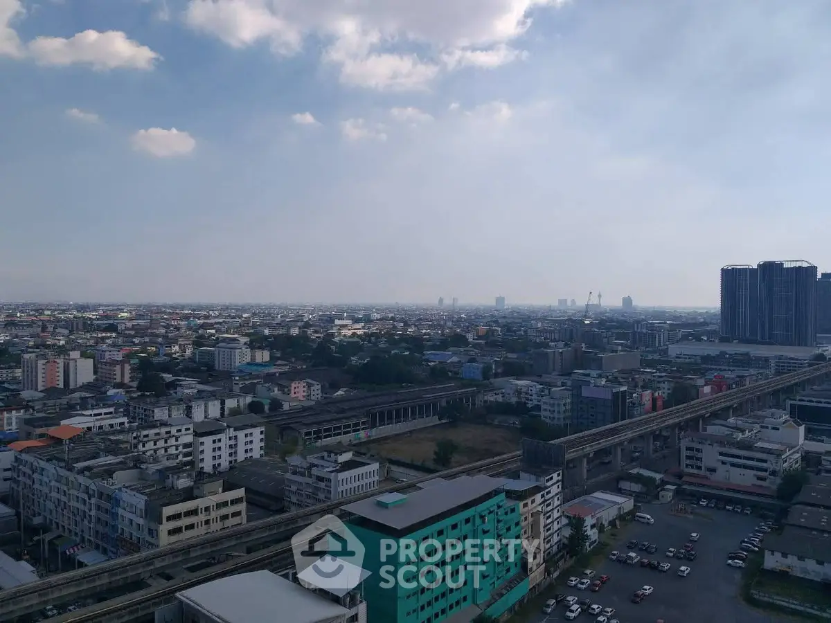 Stunning cityscape view from high-rise building showcasing urban skyline and transportation infrastructure.