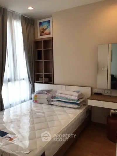 Cozy bedroom with modern furnishings and natural light
