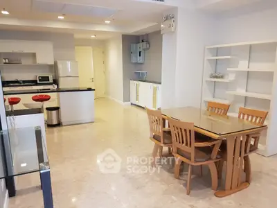 Spacious modern kitchen and dining area with sleek design and ample natural light.