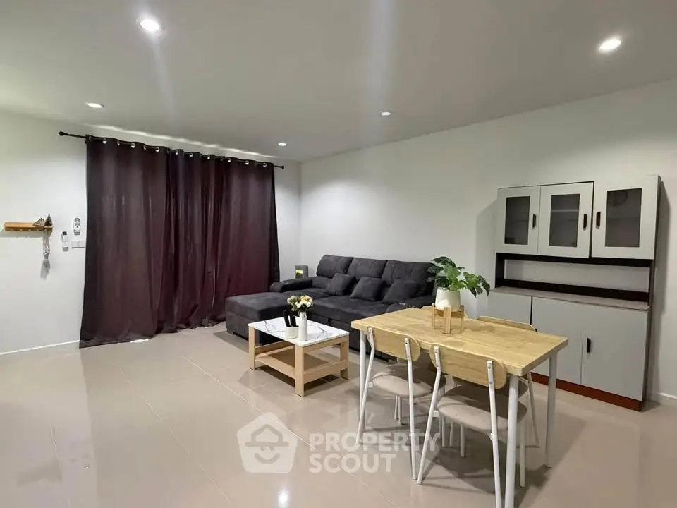 Modern living room with sleek furniture and elegant decor, perfect for comfortable living.
