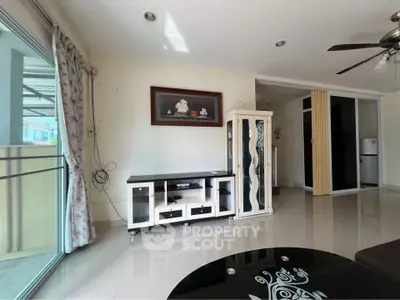 Spacious living room with modern decor and large windows for natural light.
