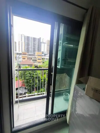 Charming urban balcony with city view, perfect for relaxation and enjoying the skyline.