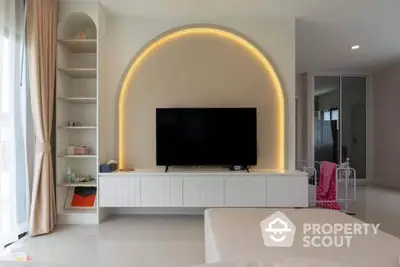 Modern living room with stylish TV unit and ambient lighting