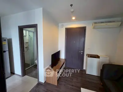 Compact modern living room with TV and air conditioning