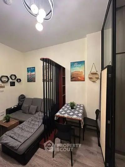 Cozy living room with modern decor and stylish furniture in a compact space.