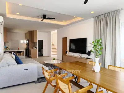 Spacious modern living room with open layout and stylish dining area