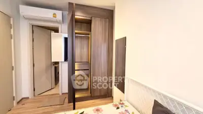 Cozy bedroom with built-in wardrobe and air conditioning, perfect for comfortable living.