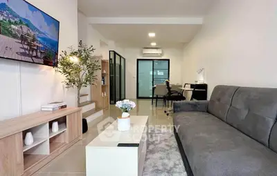 Modern living room with sleek furniture and stylish decor, perfect for urban living.
