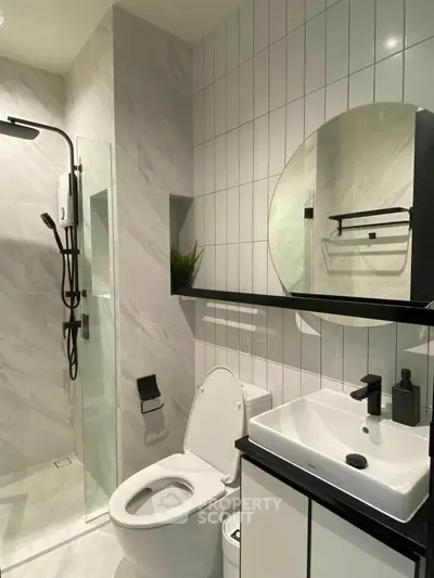 Modern bathroom with sleek fixtures and stylish shower area