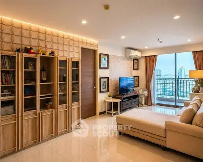 Luxurious living room with elegant decor and stunning city view from large windows.