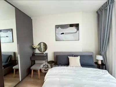 Modern bedroom with stylish decor, featuring a cozy bed, elegant artwork, and a sleek dressing table.
