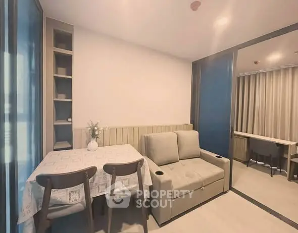 Modern living room with cozy sofa and dining area in stylish apartment