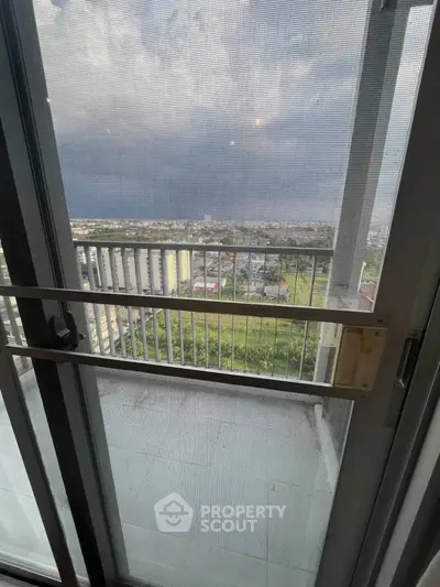Stunning high-rise balcony view with expansive cityscape and horizon.