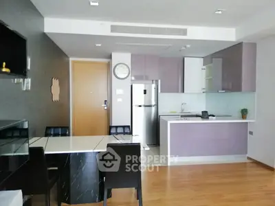 Modern kitchen and dining area with sleek design and open layout
