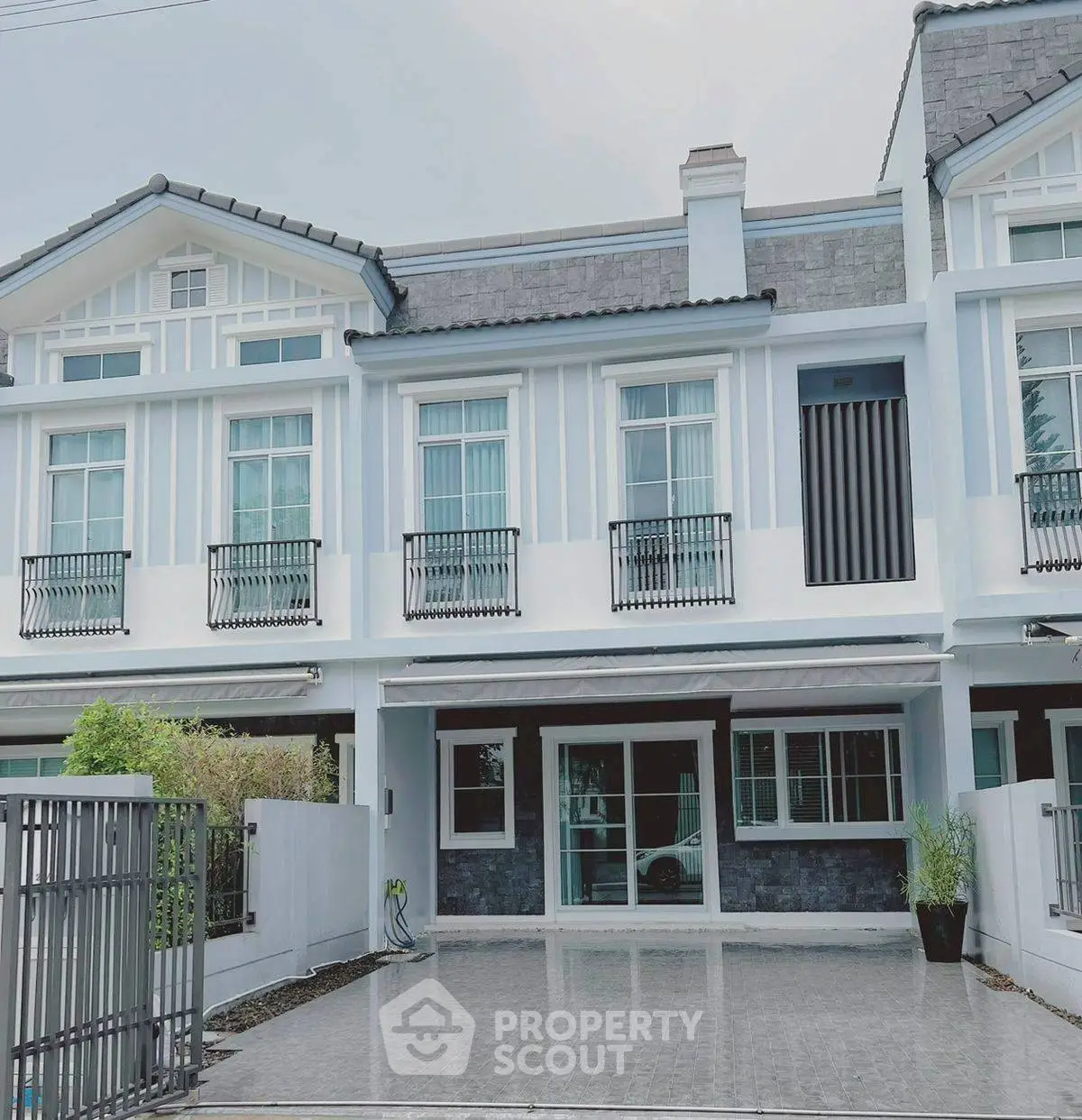 Elegant townhouse exterior with modern design and spacious driveway