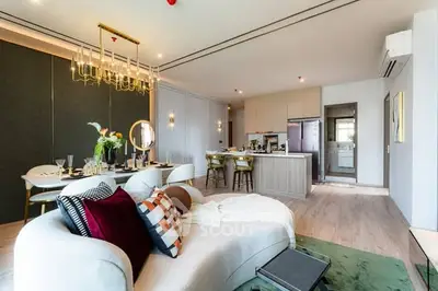 Luxurious open-plan living room with modern kitchen and elegant decor