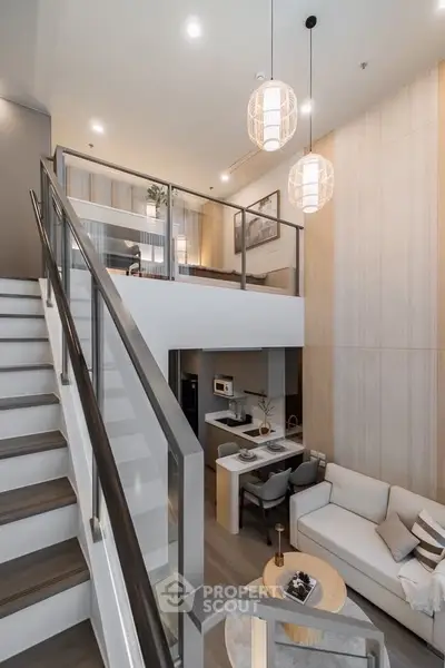 Stunning modern loft with open layout and elegant decor, featuring a spacious living area and stylish staircase.