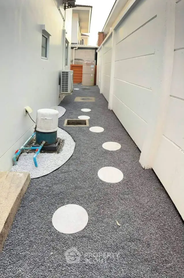 Modern exterior walkway with stepping stones and sleek design