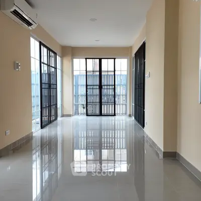 Spacious and bright living room with large windows and modern design