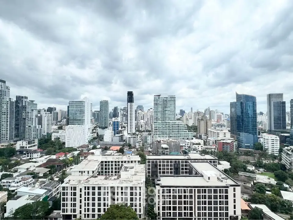 Stunning cityscape view from a high-rise building showcasing modern urban architecture and skyline.