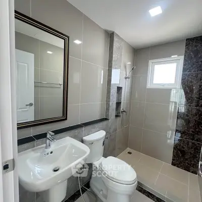 Modern bathroom with sleek fixtures and elegant tile design