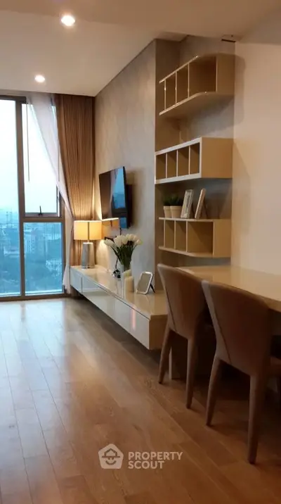 Modern living room with stylish decor and large window view