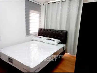 Cozy bedroom with modern decor and comfortable bed