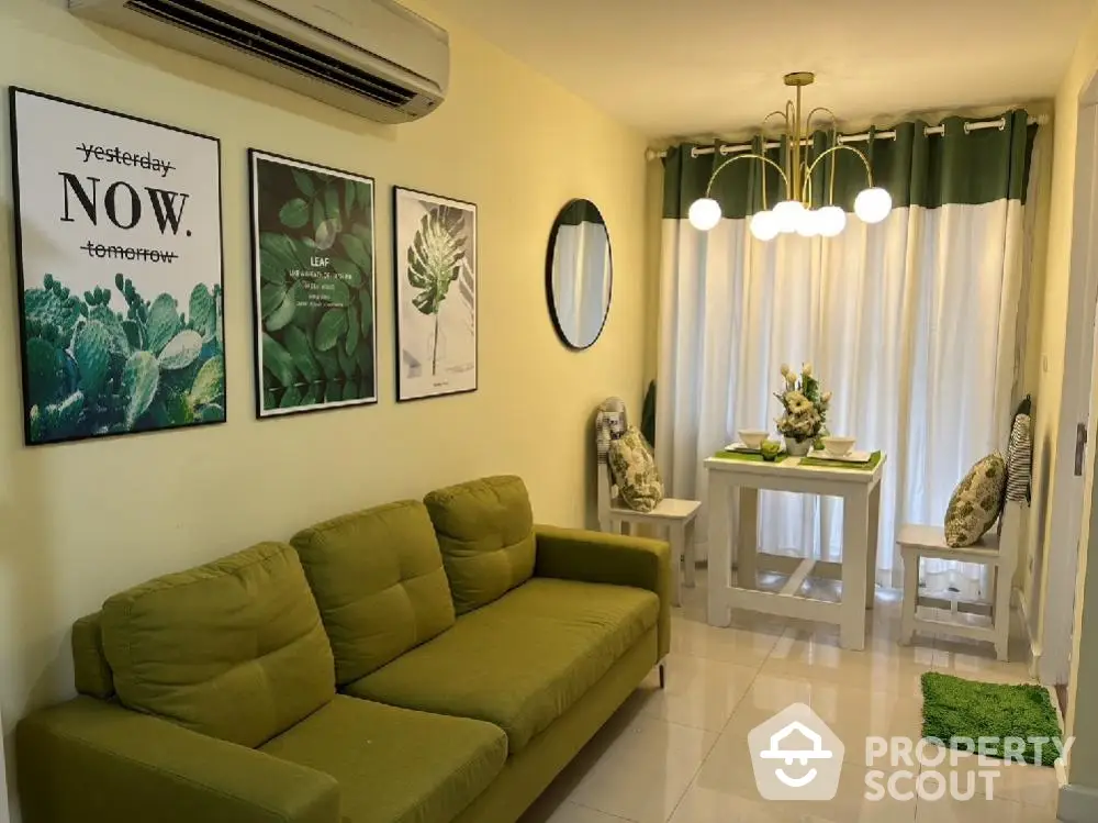 Charming living room with green sofa and modern decor, perfect for cozy gatherings.