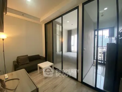 Modern apartment interior with glass partition and city view balcony