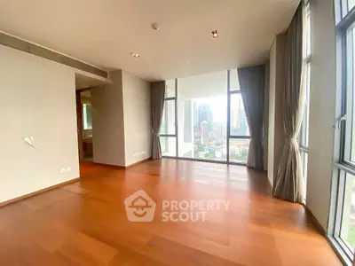 Spacious corner unit with floor-to-ceiling windows offering stunning city views.