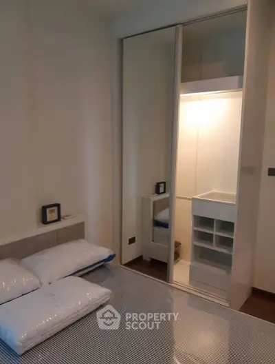 Cozy bedroom with mirrored closet and modern decor