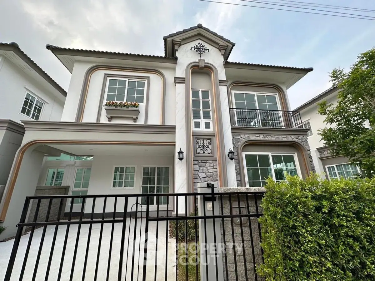 Elegant two-story house with modern architecture and lush greenery, perfect for family living.
