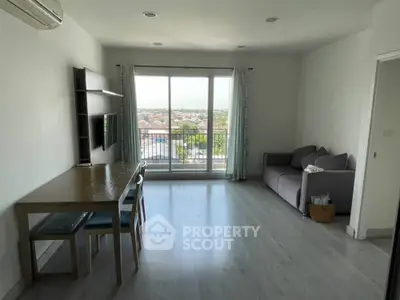 Spacious living room with balcony and scenic view in modern apartment