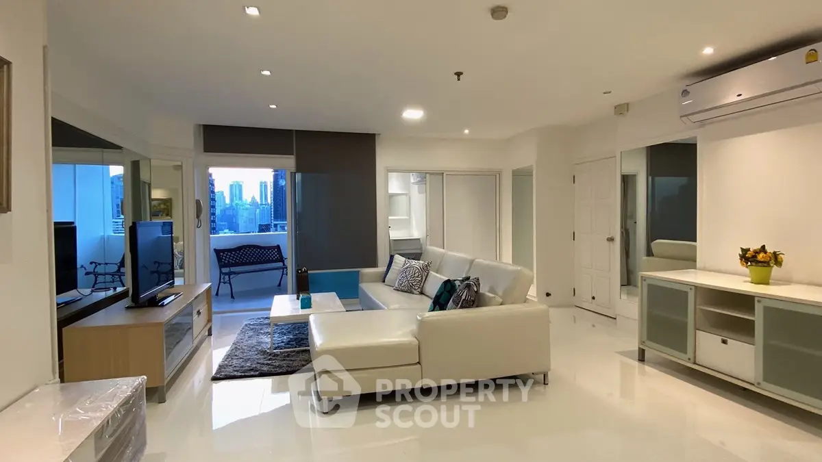 Spacious modern living room with city view and elegant white decor