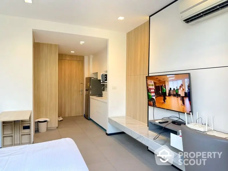 Modern studio apartment with sleek design and built-in air conditioning