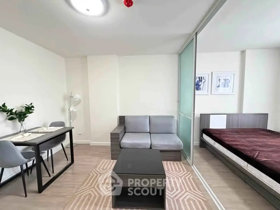 Modern studio apartment with sleek furniture and cozy ambiance