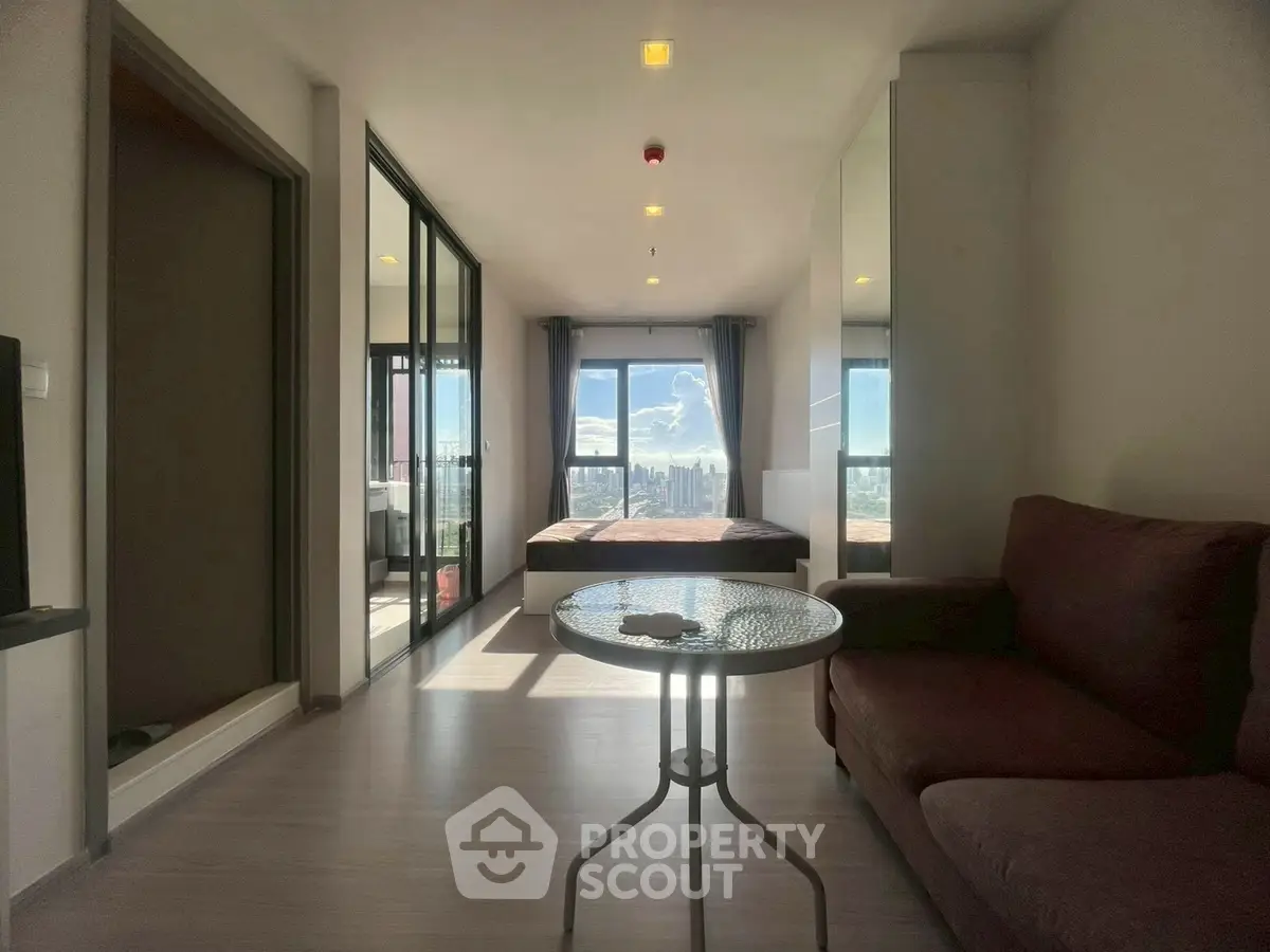Modern apartment with stunning city view and cozy living area