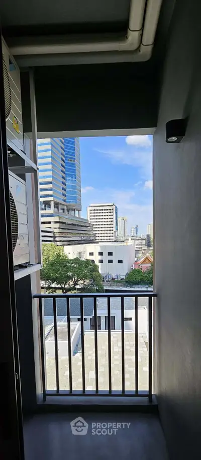 Urban balcony with cityscape view, perfect for enjoying skyline vistas.