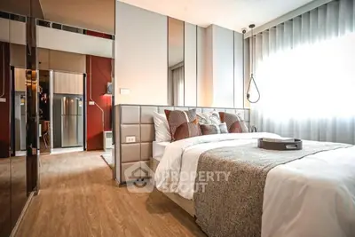 Luxurious modern bedroom with elegant decor and ample natural light
