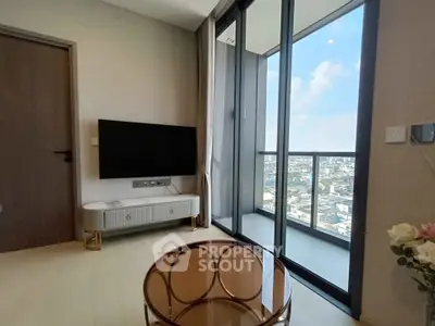 Modern living room with floor-to-ceiling windows and city view balcony