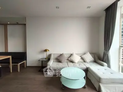 Modern living room with stylish sofa and natural light