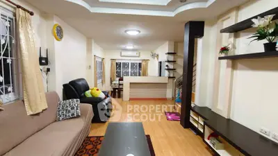 Spacious living room with modern decor and open layout, perfect for family gatherings.