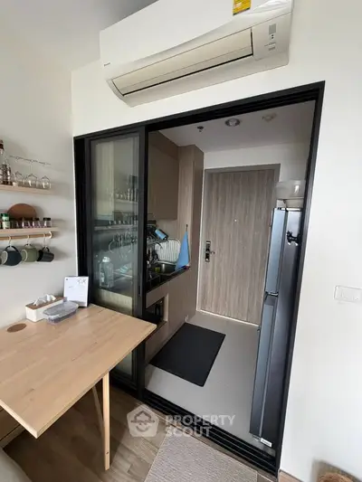 Modern kitchen with sleek design, featuring a closed layout and stylish appliances, perfect for urban living.