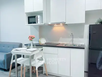 Modern compact kitchen with dining area in stylish apartment
