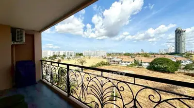 Spacious balcony with stunning cityscape view and elegant railing design.