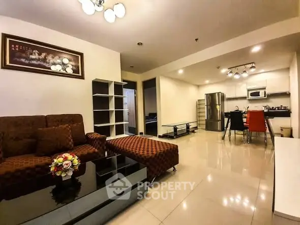 Spacious open-plan living room with modern kitchen and stylish decor